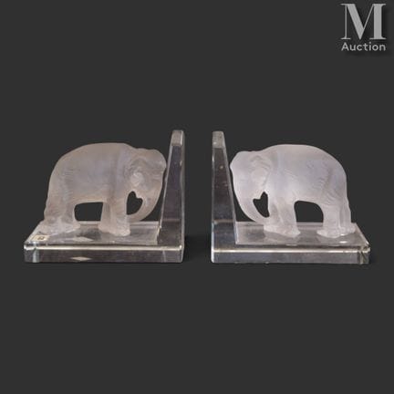 Par de sujetalibros
de cristal con la forma de dos