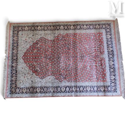 HEREKE: Wool and Silk Rug
Wool and silk rug with a