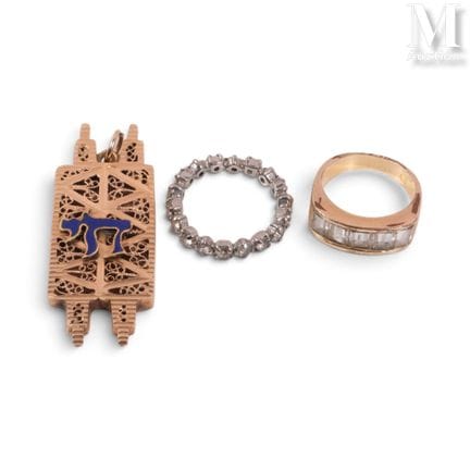Three pieces of costume jewelry, including a gold 