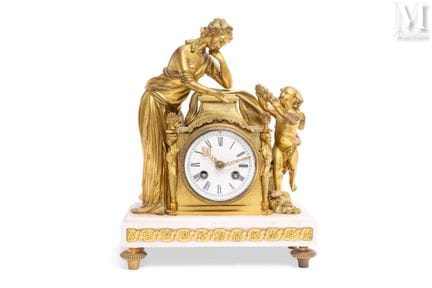 Reloj de estilo Luis XVI
De bronce dorado y mármol