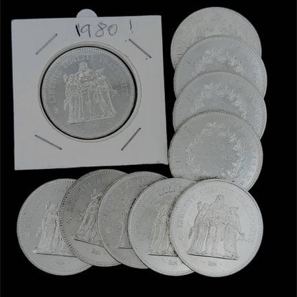 Set di 22 monete da 10 franchi in argento e 50 fra