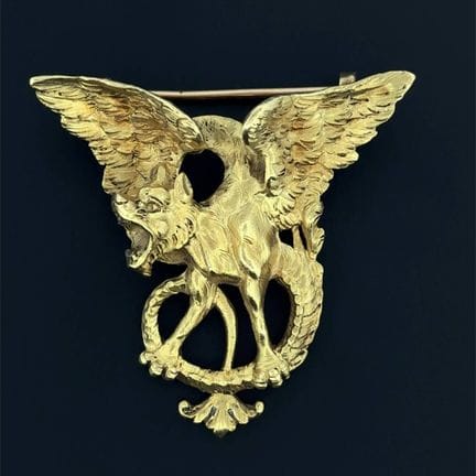 Broche "chimère" en or jaune (750) ajourée, et fin