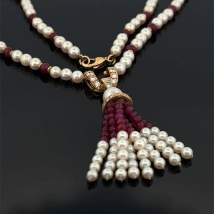 Collana "pompon" in oro giallo (750), composta da 