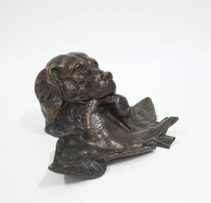 Bronze inkwell with a brown patina depicting a hun
