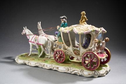 A porcelain group with polychrome and gold painted