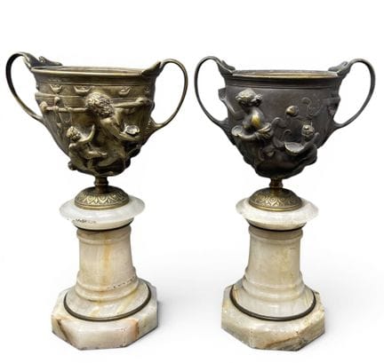 Pair of bronze cups with mythological decor of a c