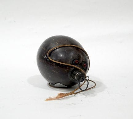 A coconut carved and shaped into a gourd or powder