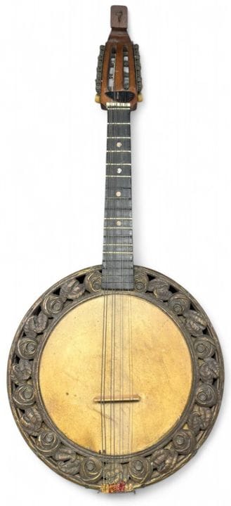 Wooden mandolin with carved stylized floral design