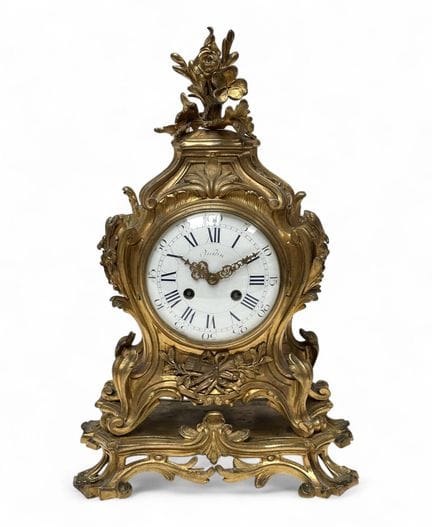 OUDIN et MARTI    
Pendule de style Louis XV en br