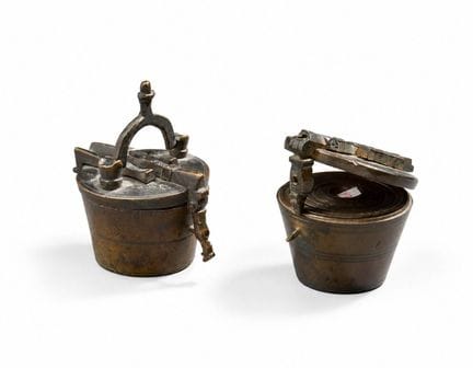 Two stacks of 1 pound bronze weights:
- Bow and ar