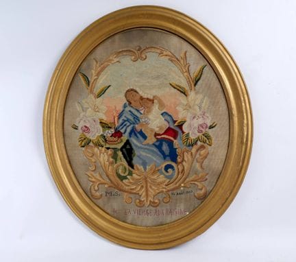 A devotional piece in petit point embroidery depic