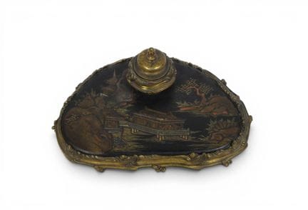 An ormolu and lacquered wood inkwell in the imitat