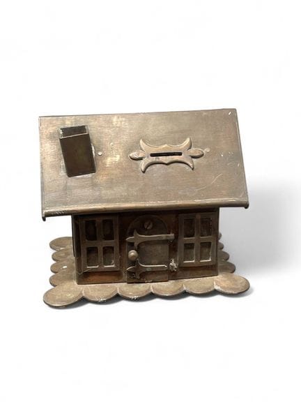Asian wooden trebuchet and house-shaped copper mon