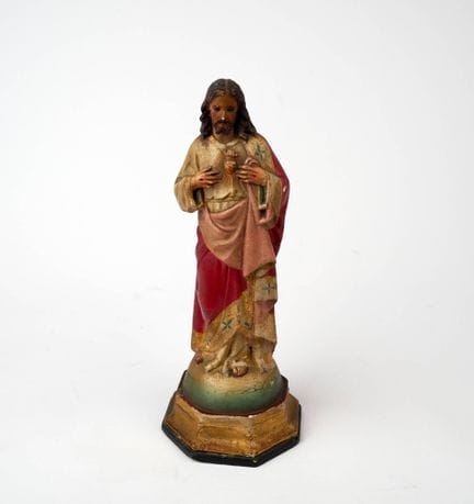 A carved, polychrome, and gilded wooden statuette 
