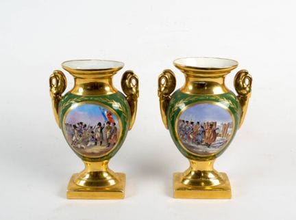 A pair of white and gilded porcelain vases of balu