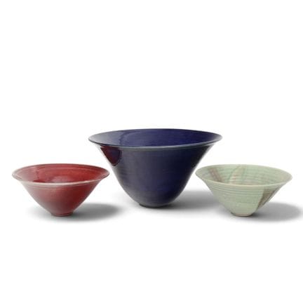 Three earthenware bowls, 20th century; including C