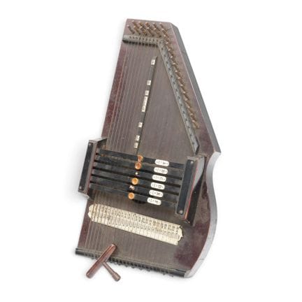 Wooden zither, 20th century. Includes tuning pegs.