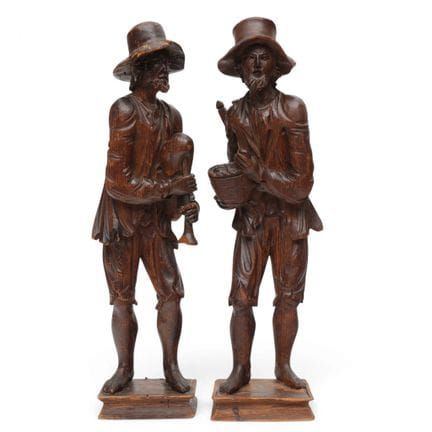 Two carved fruitwood sculptures of peddlers, late 