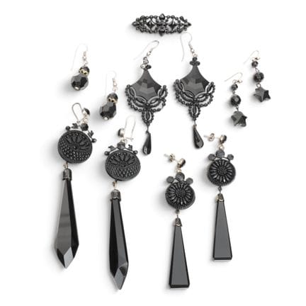 Five pairs of earrings and a brooch, all set with 