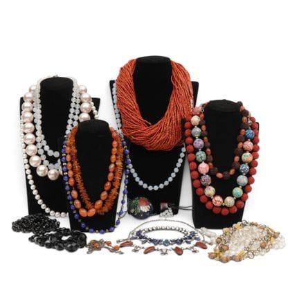 Various necklaces, including amber ones and those 