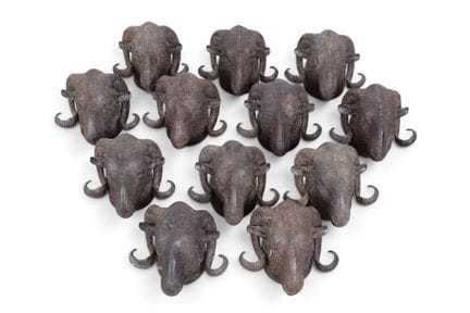 Twelve cast-iron ram heads, 20th century. H 18 cm,
