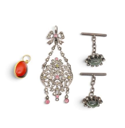 Two pendants and a pair of cufflinks: The cufflink