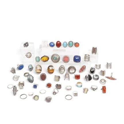 A collection of rings, including silver ones, set 