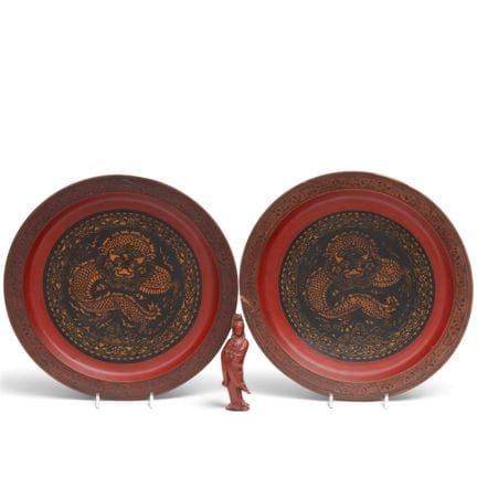 Asia, a pair of lacquered wooden "dragon" plaques,