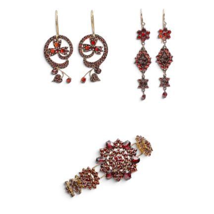 Two pairs of earrings and a bracelet. The bracelet