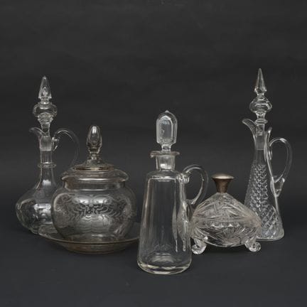 Three crystal carafes, a candy dish, and a punch b