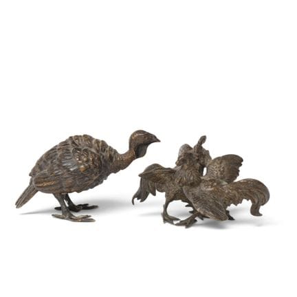 Two bronze sculptures: a cockfight and a bird, ear