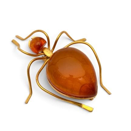 An insect brooch depicting an ant, with its body a