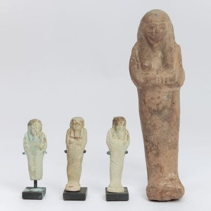 Egypt, a terracotta ushabti and three smaller faie