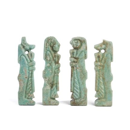 Egitto, serie di quattro amuleti in faience blu ra