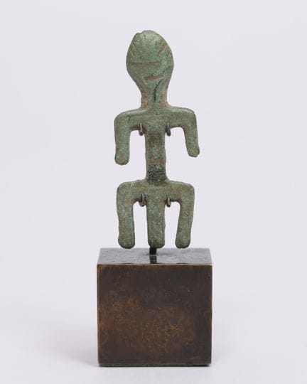 Siberia, statuetta-amuleto in metallo. L. 4,4 cm. 