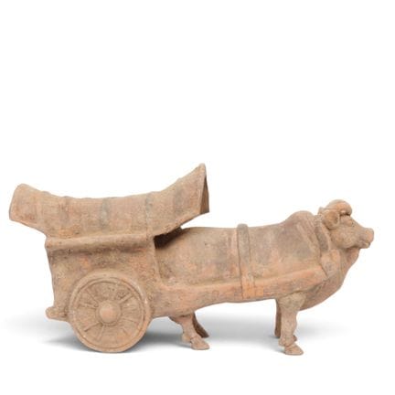 China, a red pottery model of a bull-cart, probabl