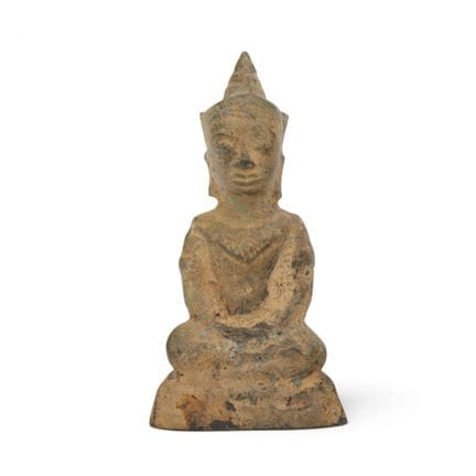 Thailand, a small bronze figure of Buddha in a sea