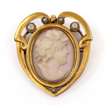 A heart-shaped cameo brooch, ca. 1900. Set with a 