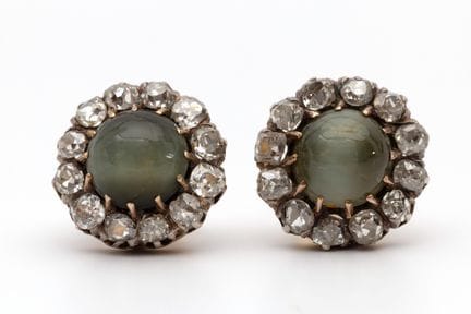 A pair of cat's eye and diamond earrings, set with