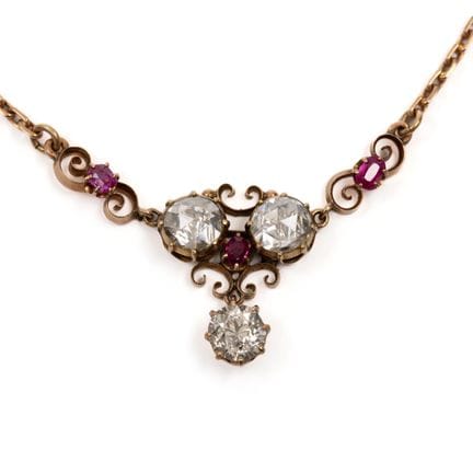 A diamond and ruby necklace. The front consists of
