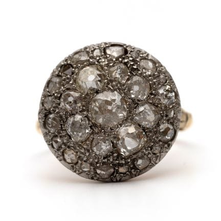 A diamond cluster ring with a large rounded top, s