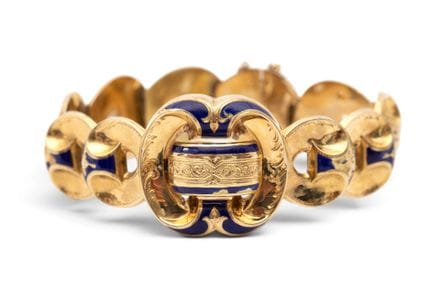A mid-19th-century repoussé bracelet composed of h