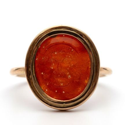 An intaglio ring depicting a Greek mask, carved fr