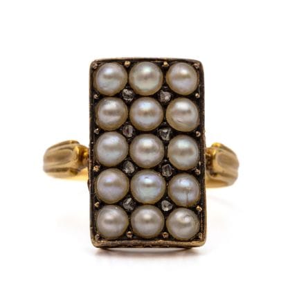 A pearl and diamond panel ring set with fifteen sp
