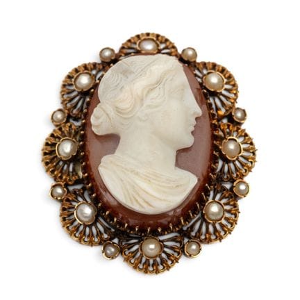 A 19th-century cameo brooch. Set with an agate cam