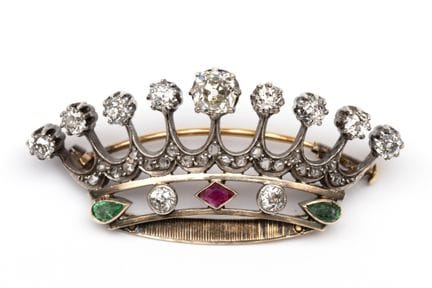 A diamond- and gem-set crown brooch depicting a ni