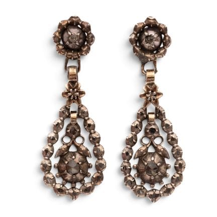 A pair of diamond drop-shaped earrings, consisting