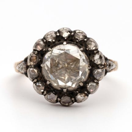 A diamond cluster ring. Set with rose-cut diamonds