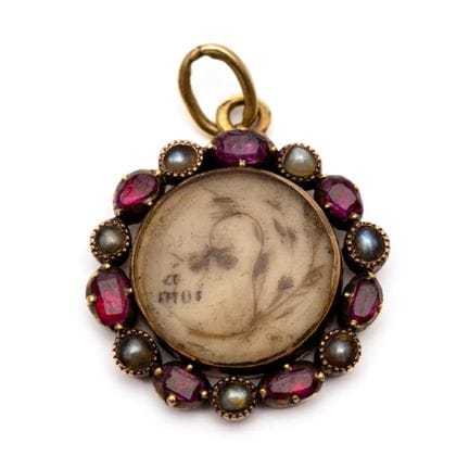An early 19th-century hairwork pendant depicting a