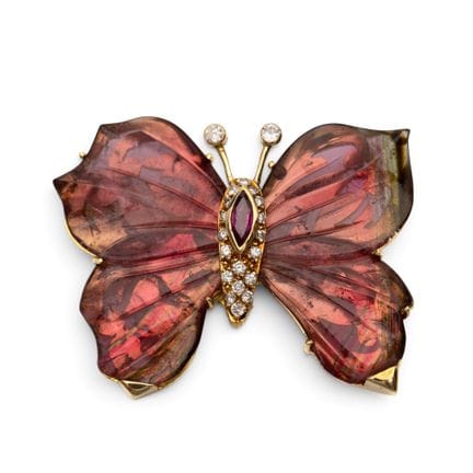 Une broche papillon sertie de pierres précieuses, 